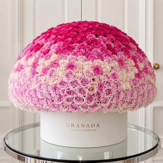 Stunning ombré rose dome with 200+ roses transitioning from hot pink to soft lavender in white Granada Lovely Flowers hatbox