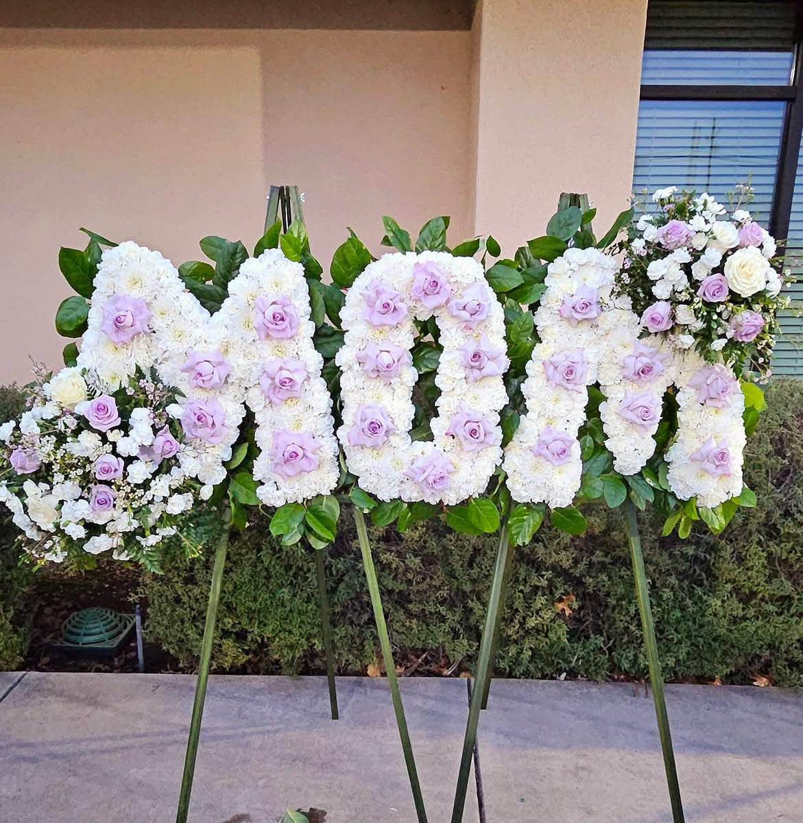 MOM funeral standing spray with white flowers and lavender roses – Granada Floral San Diego