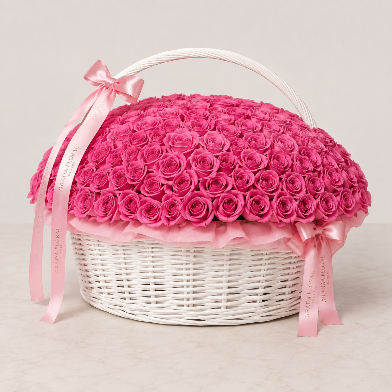 100 hot pink roses in white wicker basket with Granada Floral pink satin ribbon – San Diego