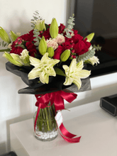 Lilys and roses in vase