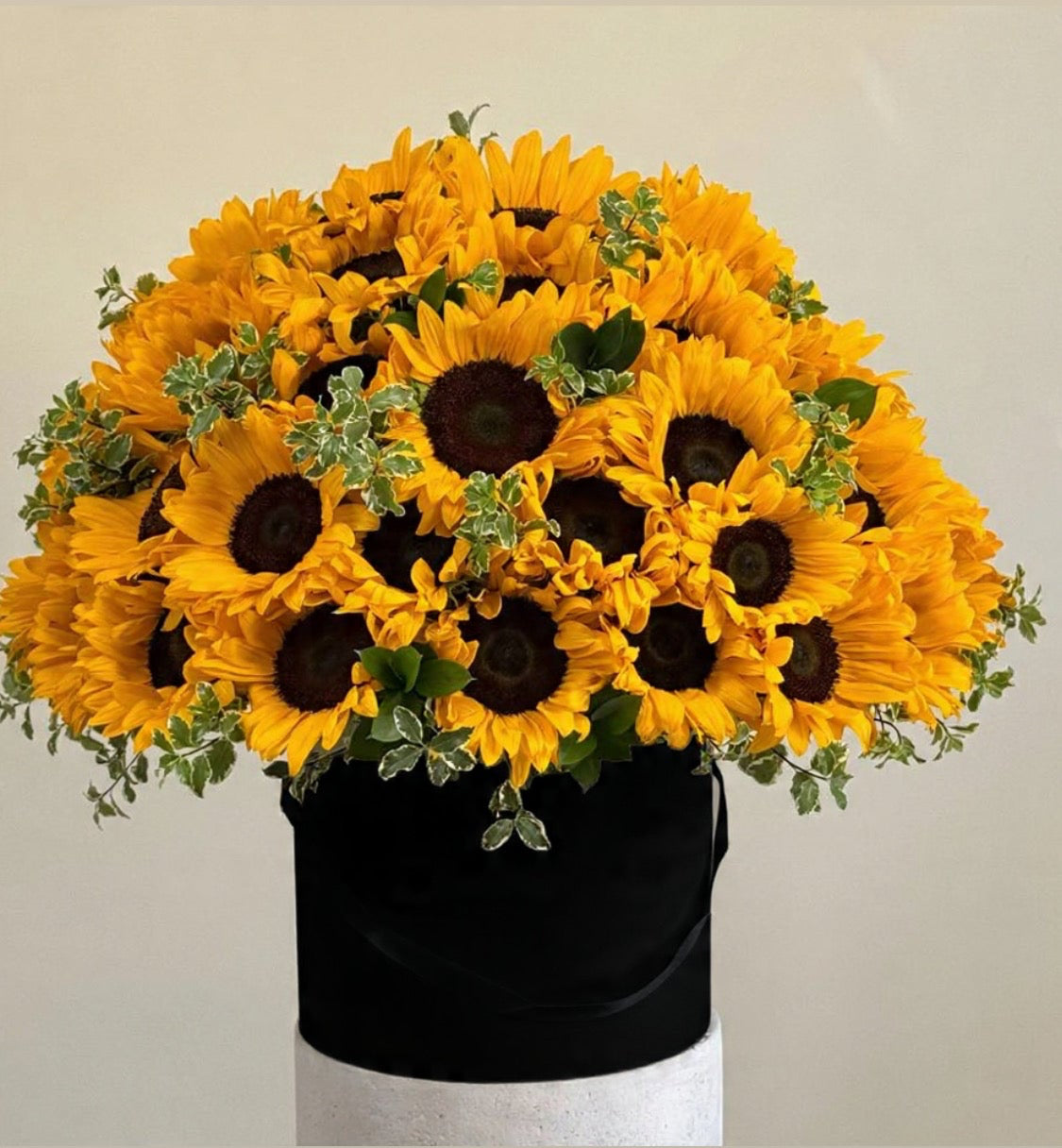 Sunflowers with carnations in box