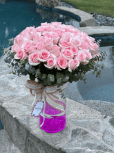 Floating roses in vase