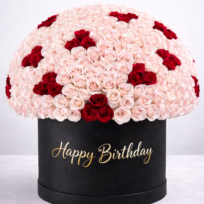Black box with pink and red roses and 'Happy Birthday' text on a white background