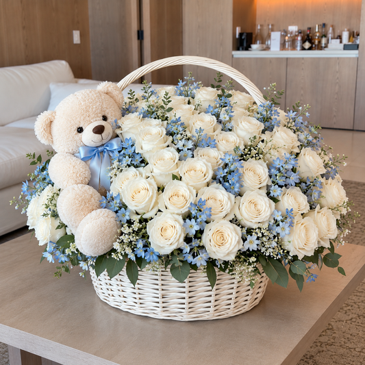 White and blue baby welcome rose basket with teddy bear