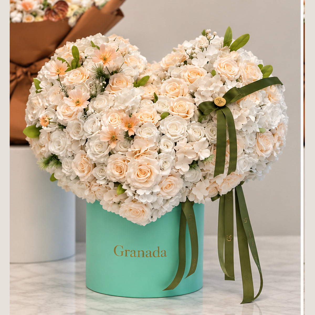 Turquoise Granada heart shaped ivory and peach flower box San Diego florist