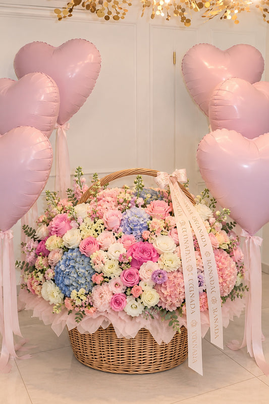 Luxury pastel flower basket with pink heart balloons Granada Floral San Diego