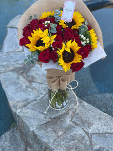 Sunflowers roses in vase